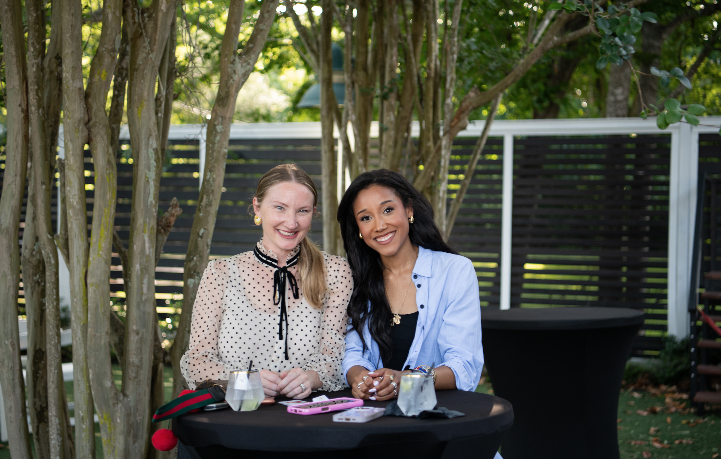 2 women enjoy the garden outdoor venue space